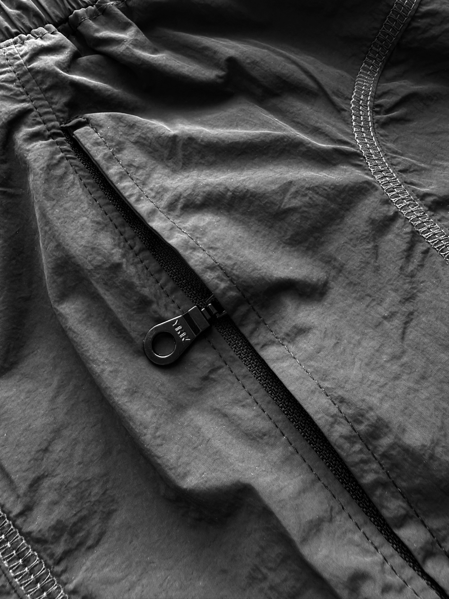 BLACK NYLON OVERLOCK SHORTS