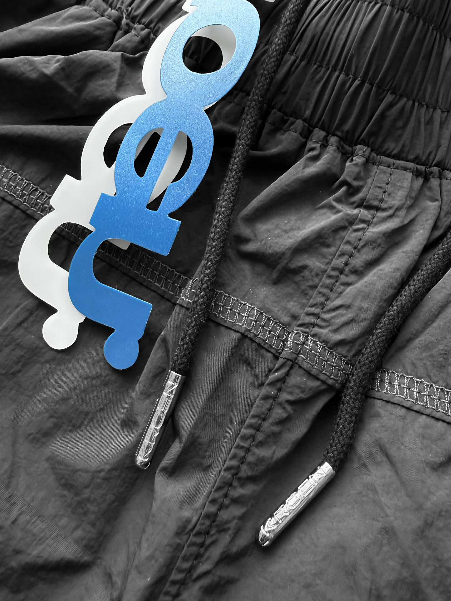 BLACK NYLON OVERLOCK SHORTS