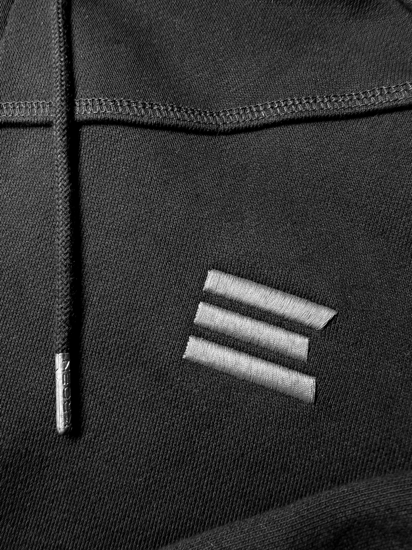 BLACK OVERLOCK HOODIE