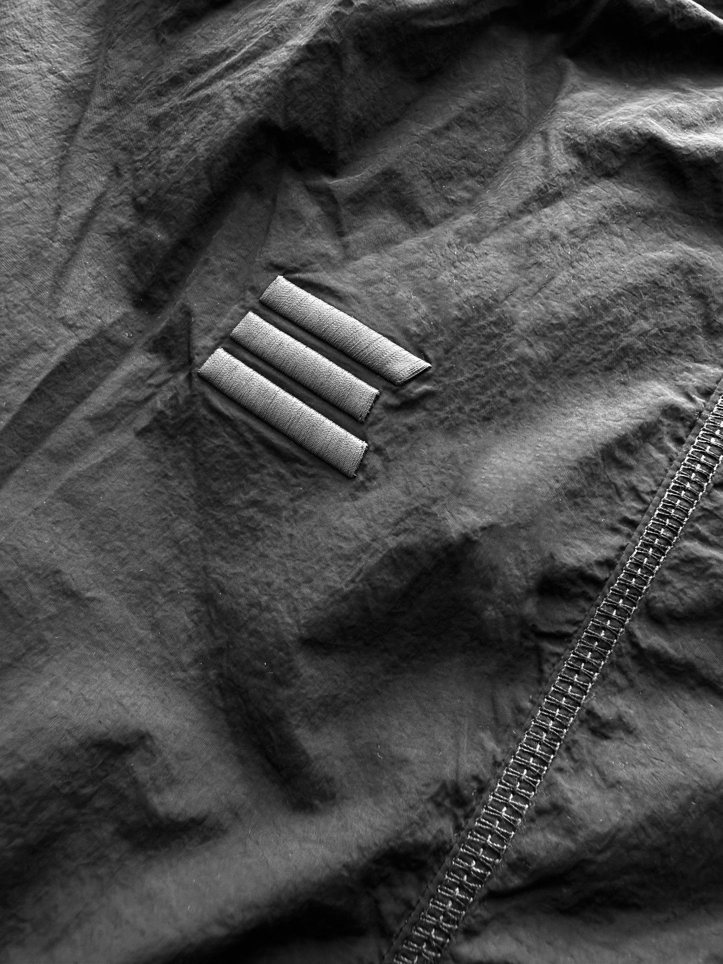 BLACK NYLON OVERLOCK SHORTS